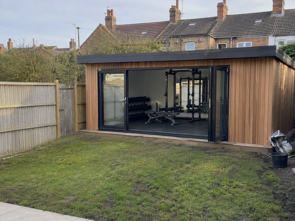 Cedar clad garden room fitted out as a home gym